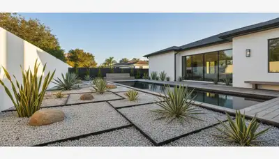 Modern pea gravel landscape with geometric lines and native plants in Bradenton, FL by Chop Chop Landscaping